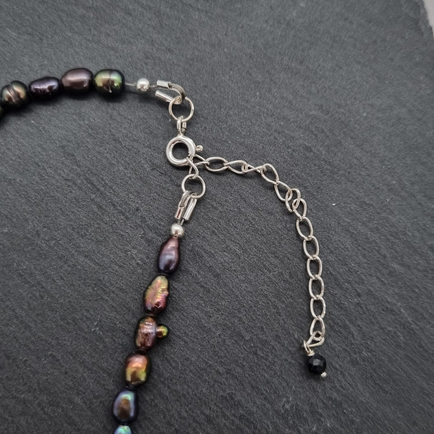 3D faceted hand carved sterling silver star on a grey peacock freshwater pearl bead necklace by Jo Cooper