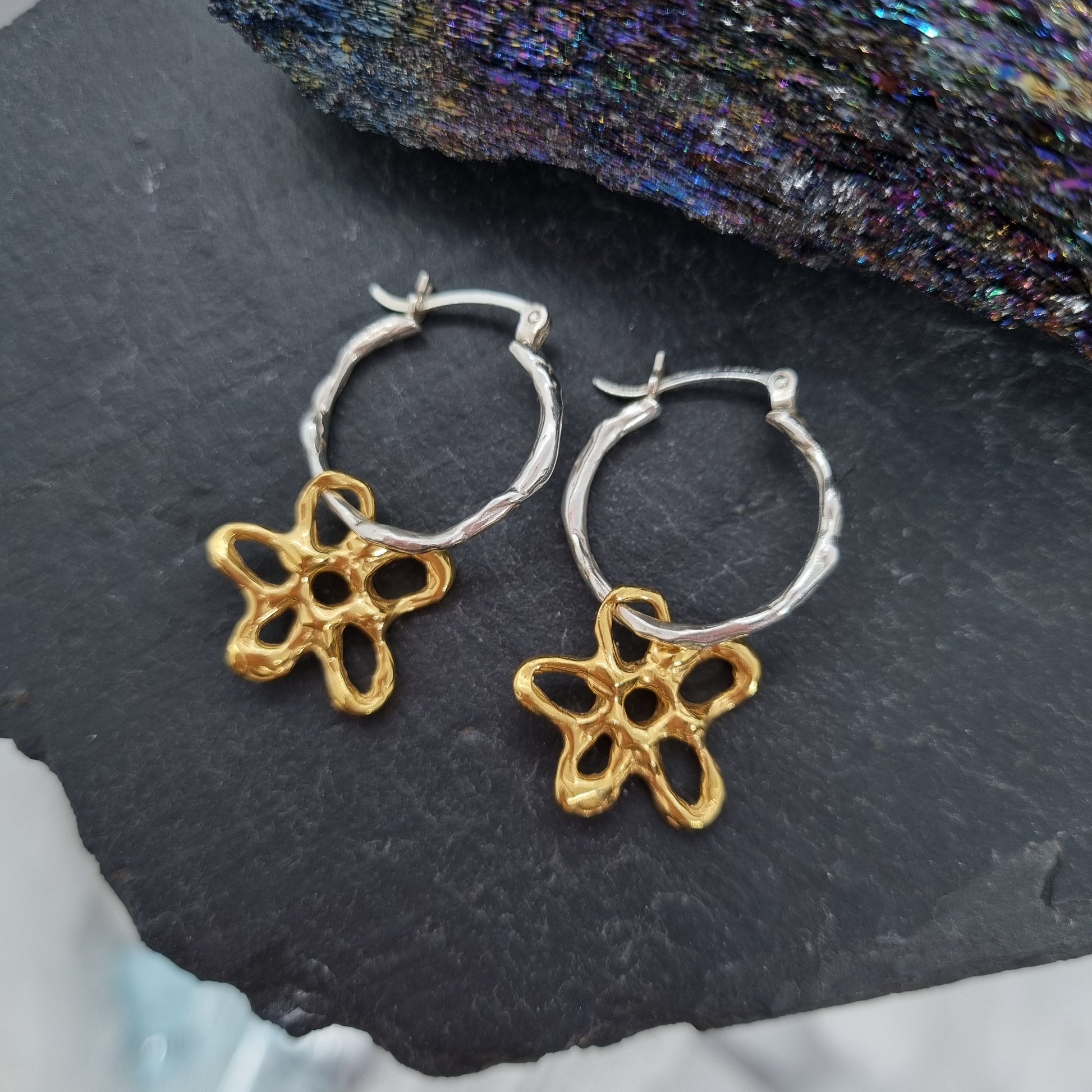 gold flower and silver hoop earrings