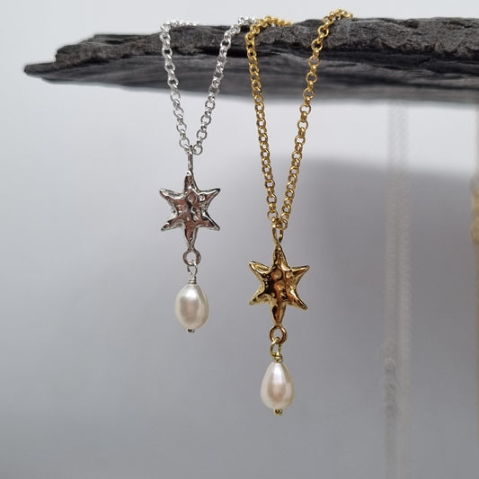 Gold plated and sterling silver star-shaped necklace with pearls made by Jo Cooper