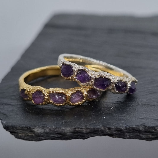 multi raw amethyst sterling silver and gold plated vermeil rings handmade by Jo Cooper. Stacked together on a black slate background