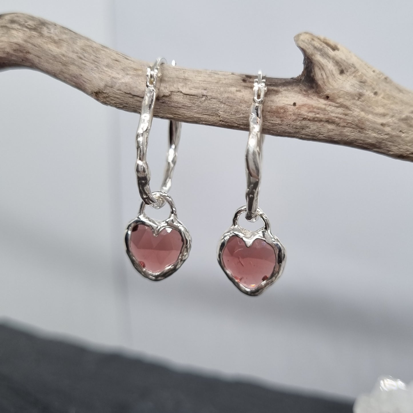 Heart-shaped rose cut red garnet molten sterling silver molten hoops earrings handmade by Jo Cooper Jewellery