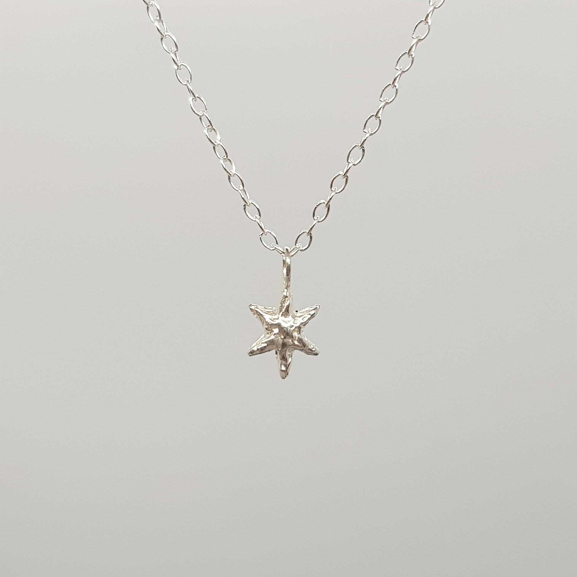 tiny molten star necklace sterling silver