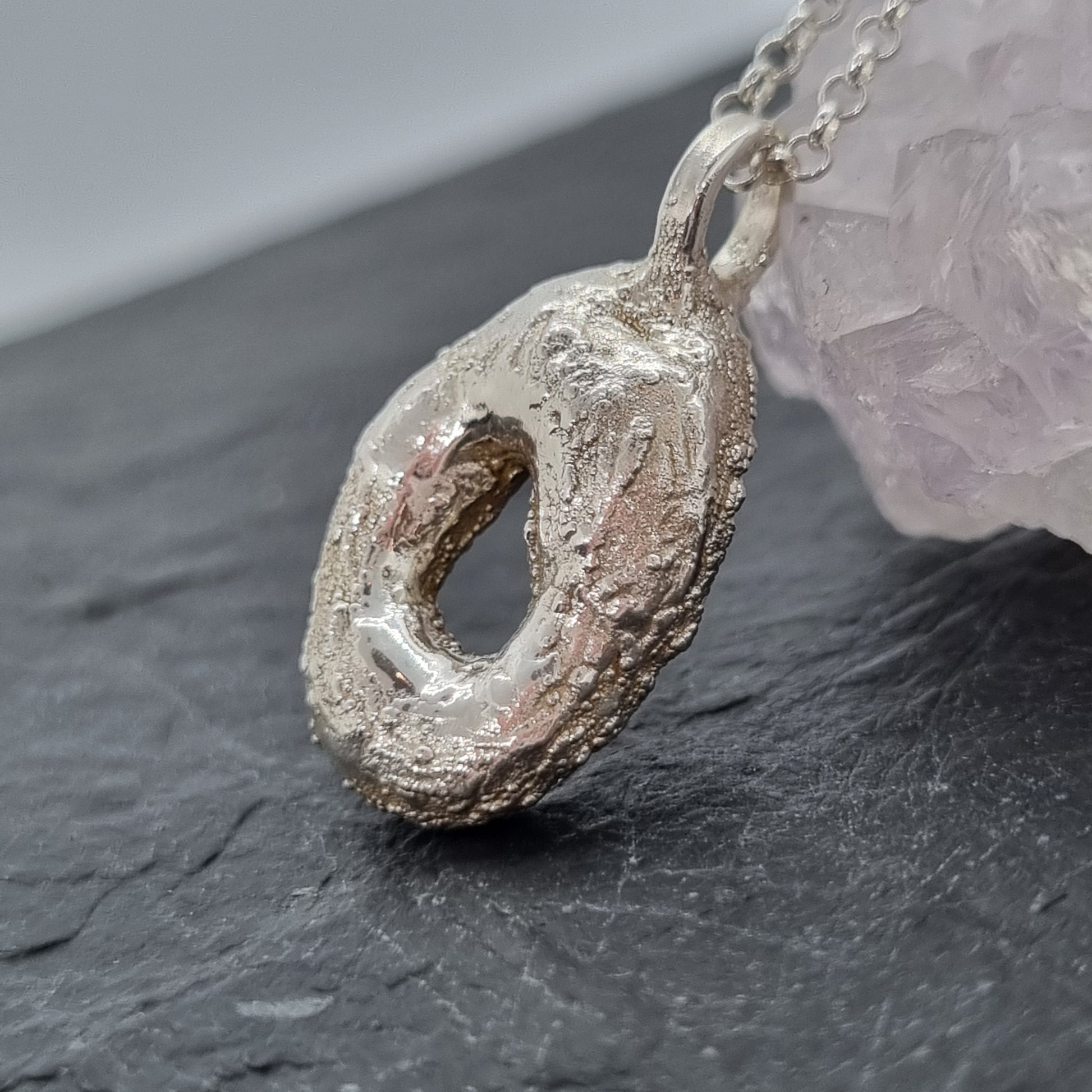 back of glass pendant showing electroformed silver setting by Jo Cooper and SIECES GLASS