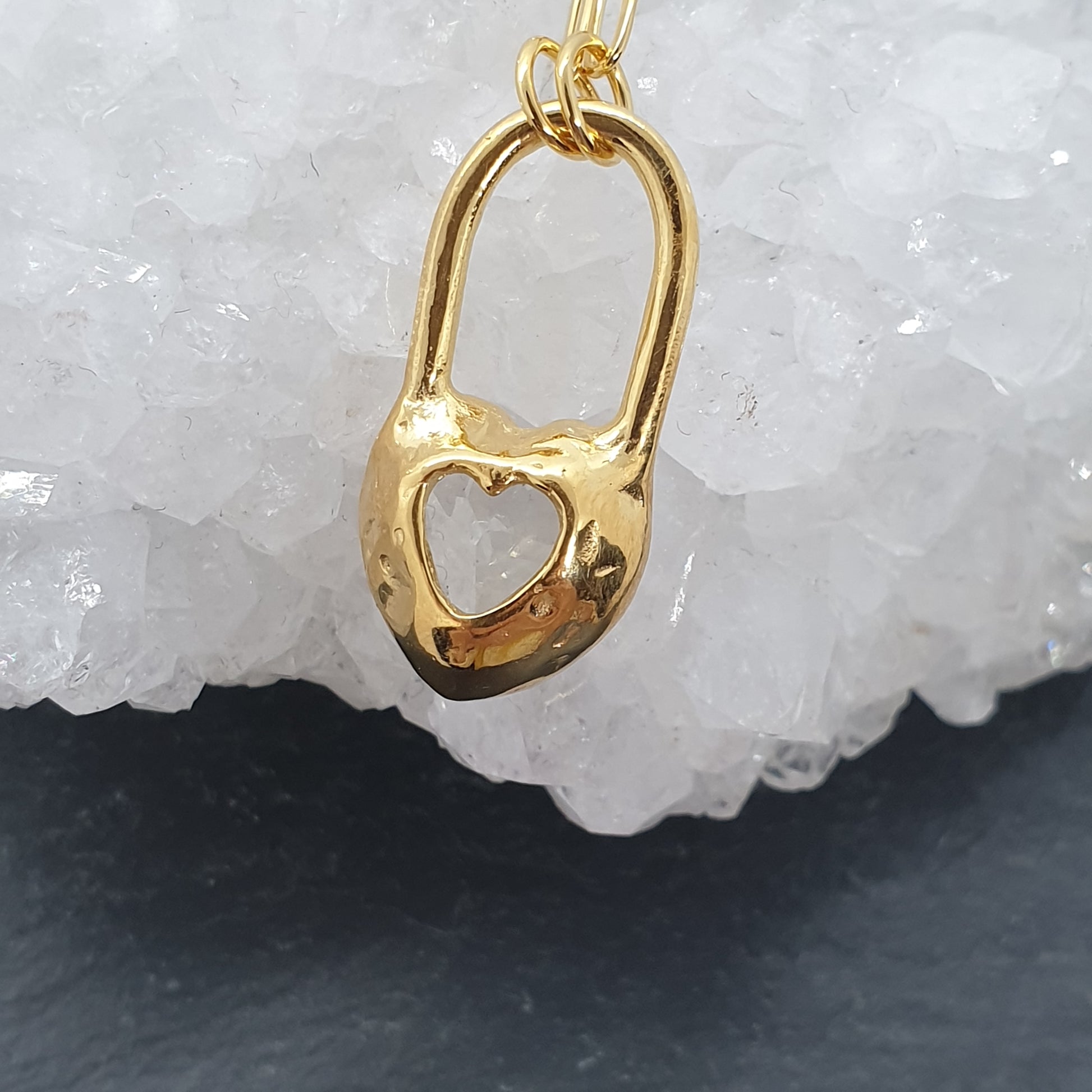 back of heart lock necklace showing secret cut out heart design