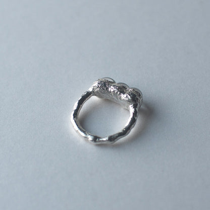 Sterling silver and glass bubble ring on a light grey background by Jo Cooper and SEICES GLASS jewellery