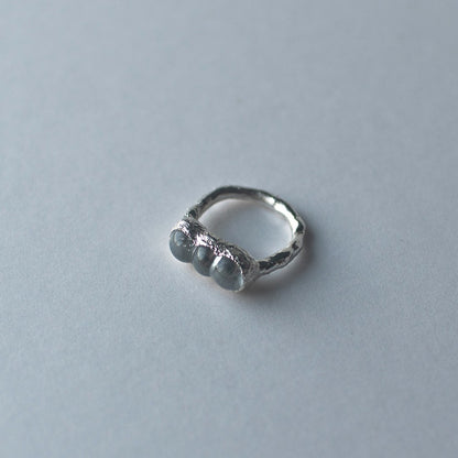 Sterling silver and glass bubble ring on a light grey background by Jo Cooper and SEICES GLASS jewellery