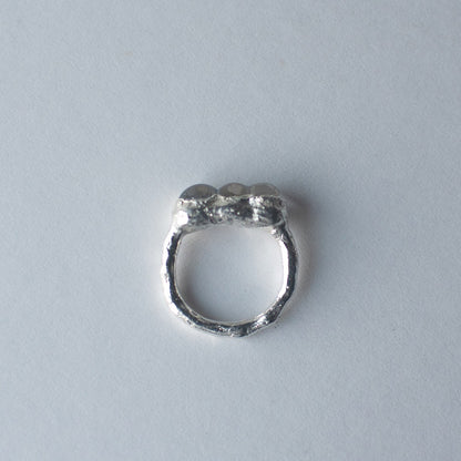 Sterling silver and glass bubble ring on a light gray background by Jo Cooper and SEICESGLASS jewellery