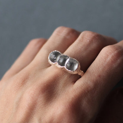 Sterling silver and glass bubble ring on a model's hand by Jo Cooper and SEICES GLASS jewellery