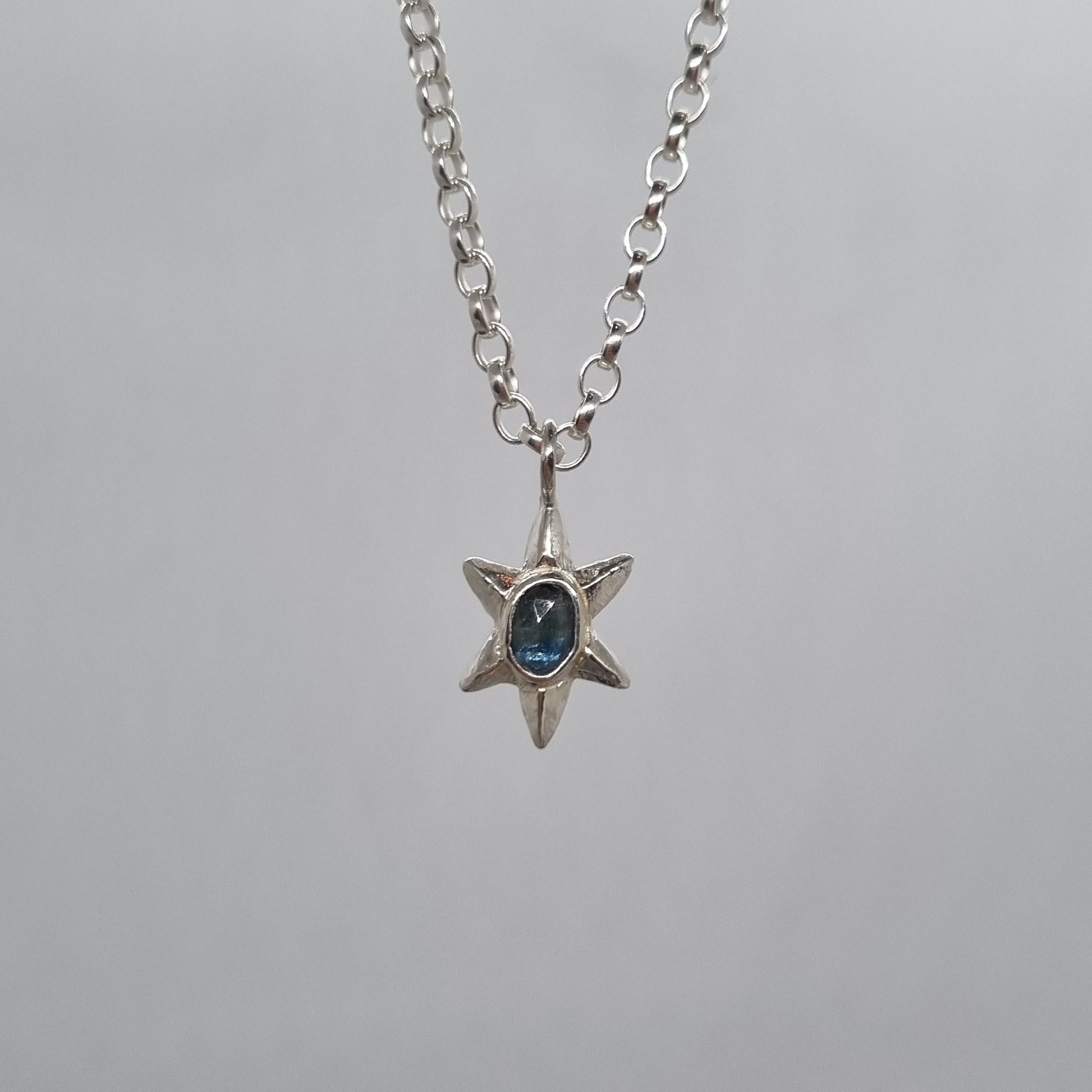 rose cut teal blue sapphire sterling silver star necklace hand carved and handmade in recycled sterling silver by Jo Cooper Jewellery