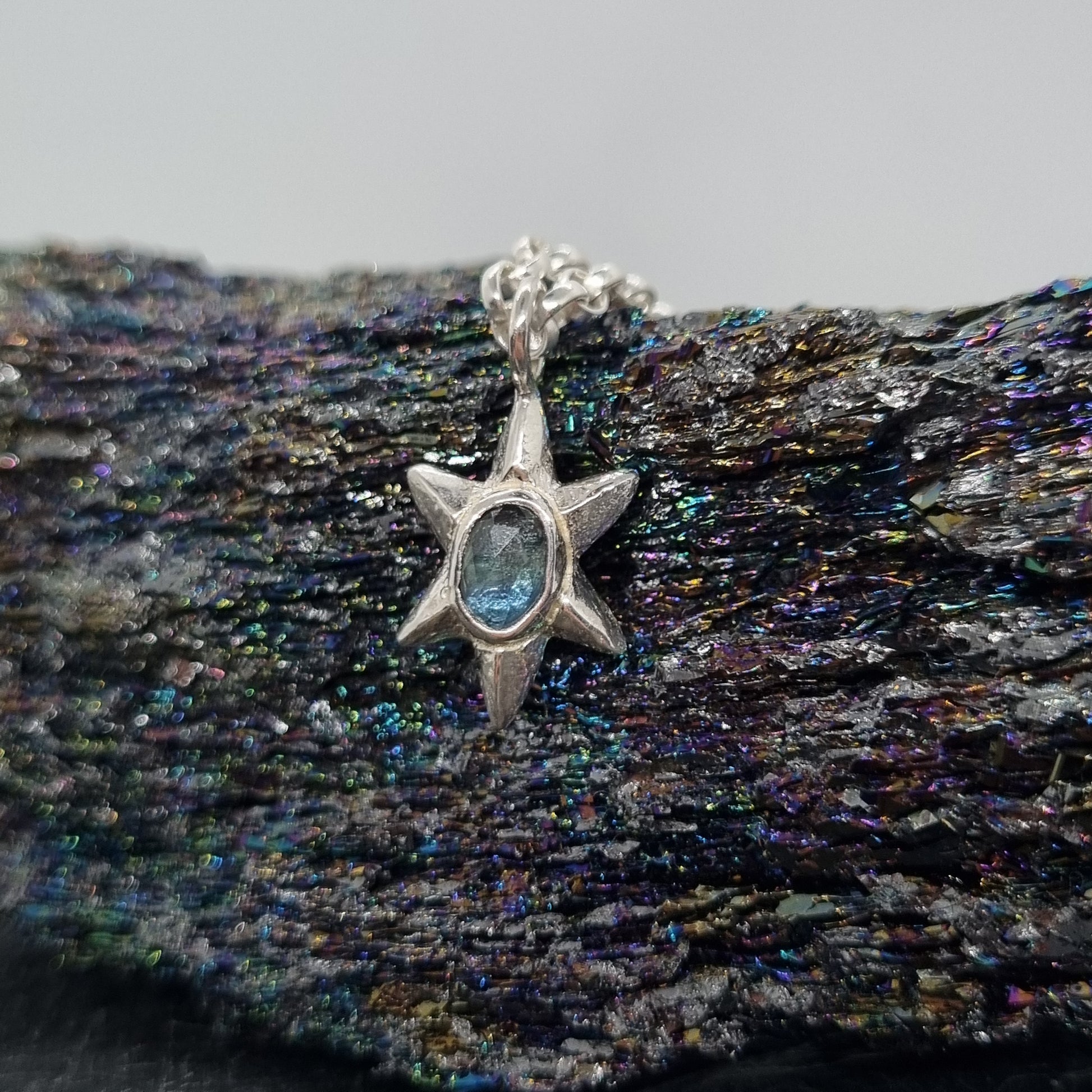 rose cut teal blue sapphire sterling silver star necklace hand carved and handmade in recycled sterling silver by Jo Cooper Jewellery