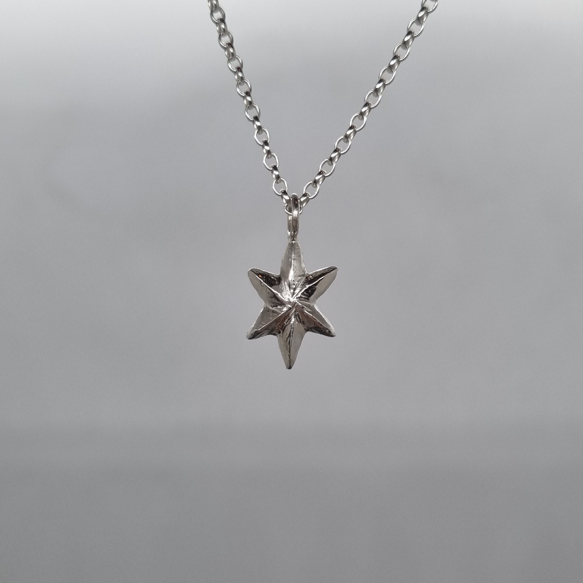 recycled sterling silver 3D facet star necklace hand carved and handmade in recycled sterling silver by Jo Cooper Jewellery