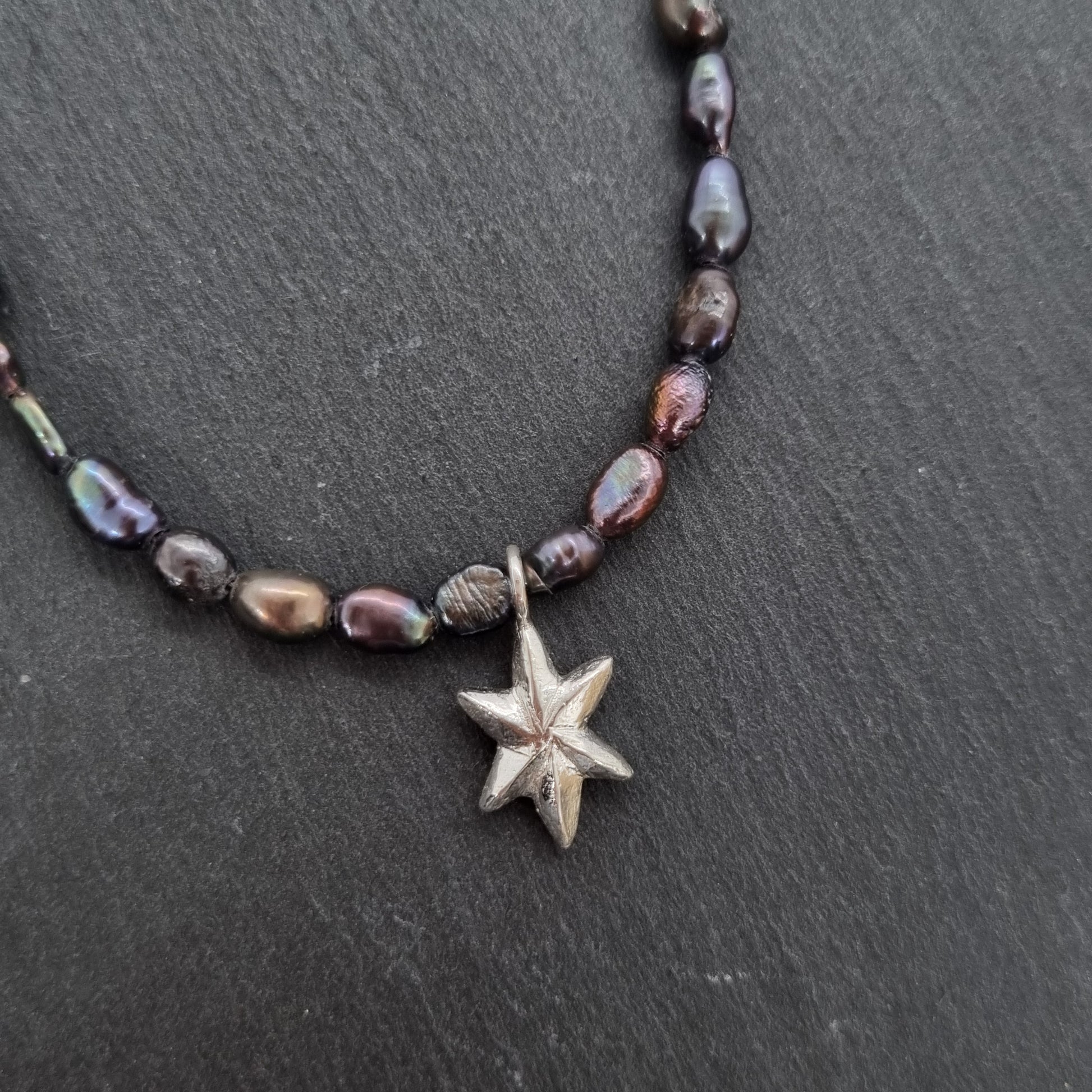 3D faceted hand carved sterling silver star on a grey peacock freshwater pearl bead necklace by Jo Cooper