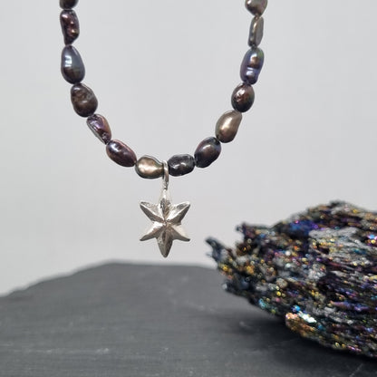3D faceted hand carved sterling silver star on a grey peacock freshwater pearl bead necklace by Jo Cooper