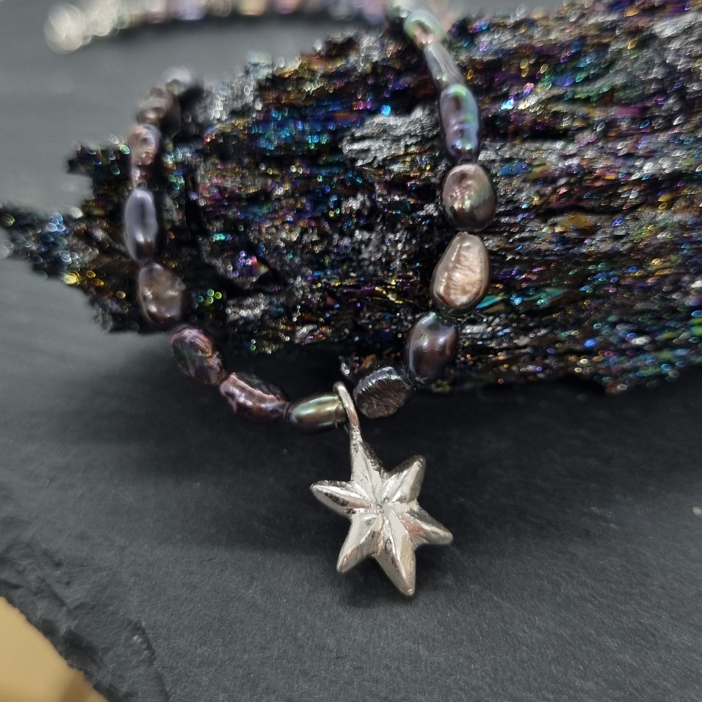 3D faceted hand carved sterling silver star on a grey peacock freshwater pearl bead necklace by Jo Cooper
