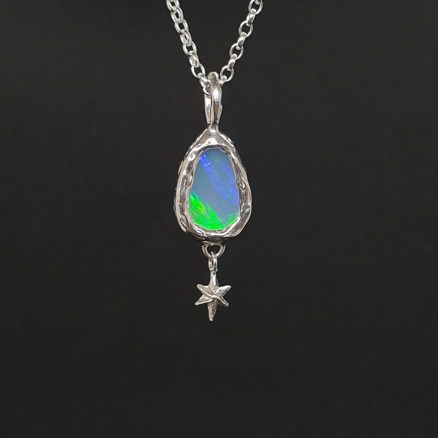 back of freeform opal necklace with star