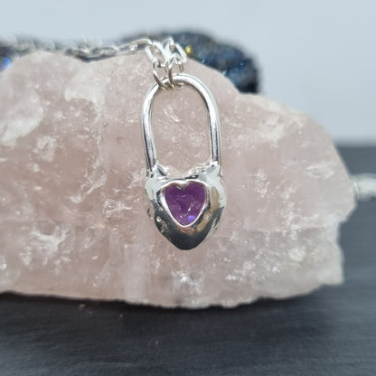 a sterling silver heart lock necklace with deep amethyst showing a cut out heart design on the back handmade by Jo Cooper Jewellery