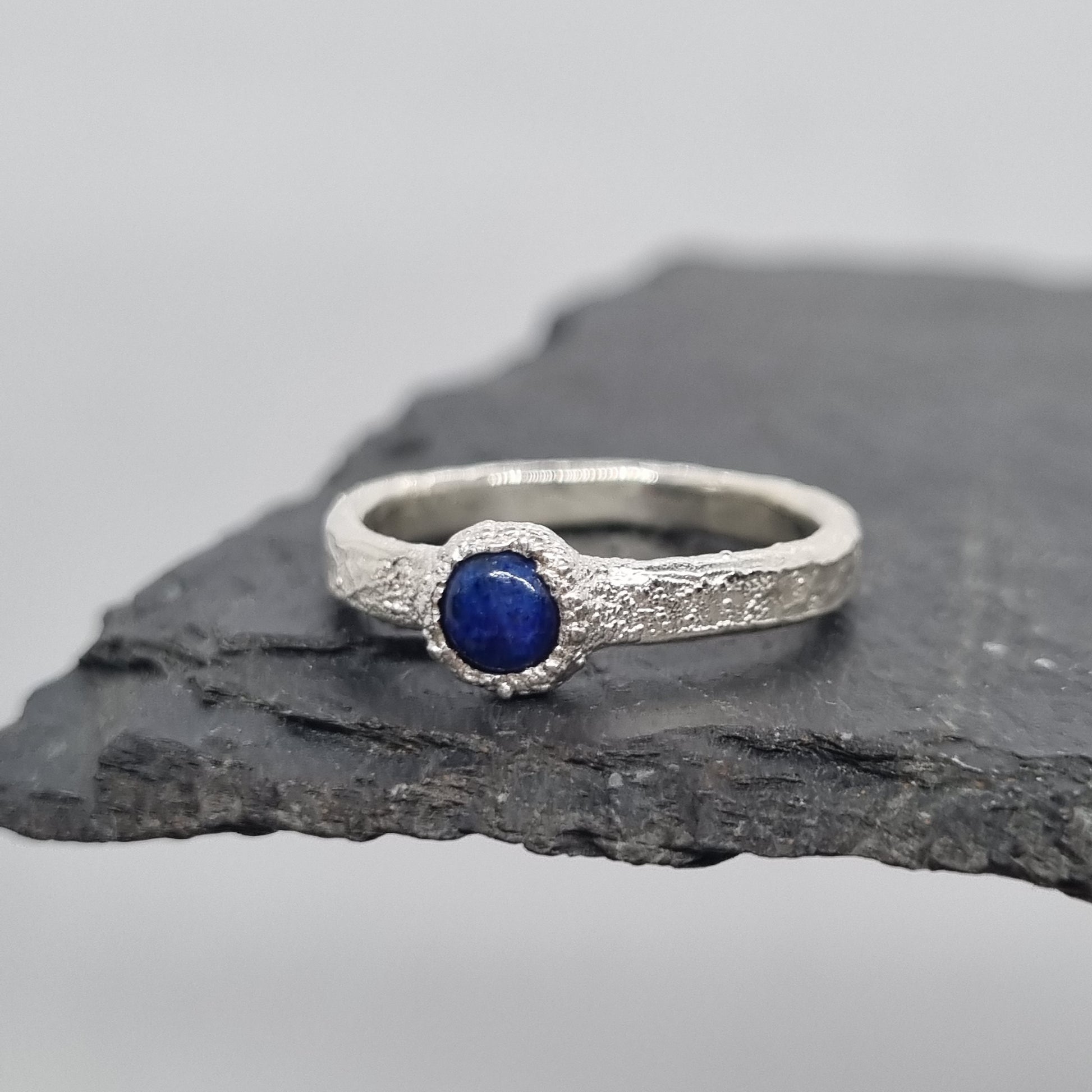 handmade recycled sterling silver textured ring with a lapis lazuli cabochon