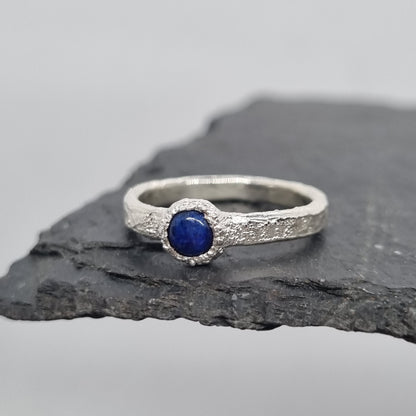 handmade recycled sterling silver textured ring with a lapis lazuli cabochon