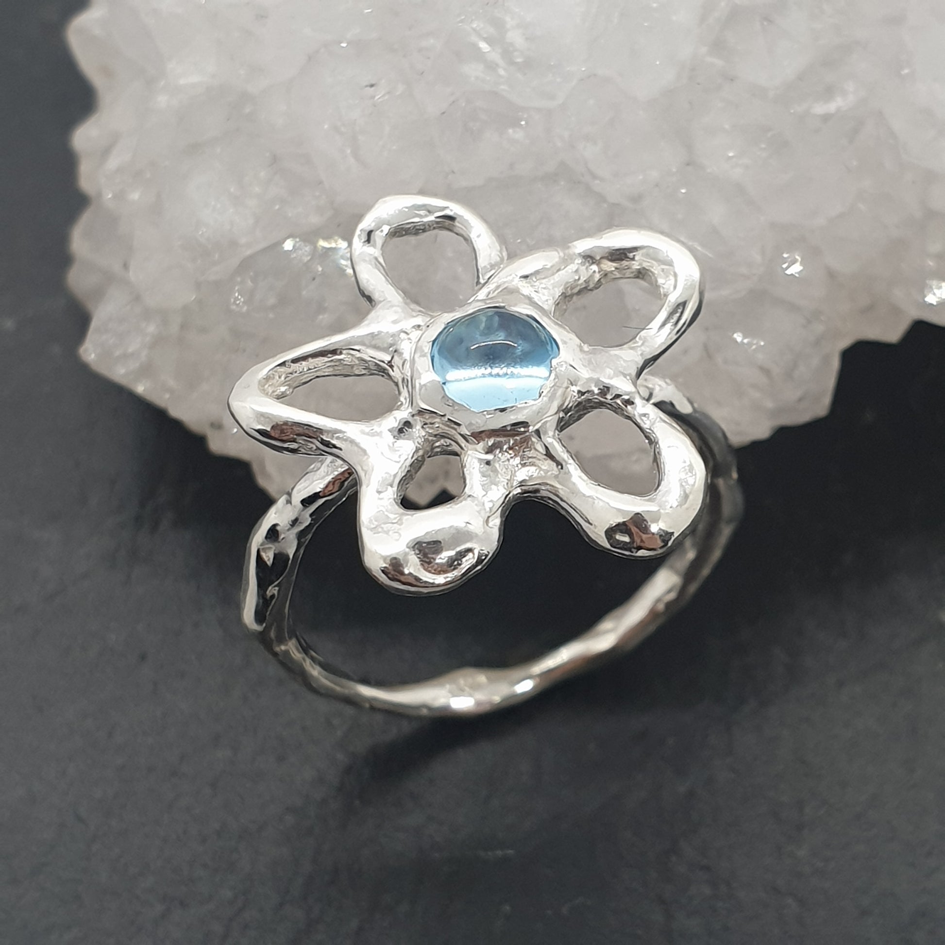 sterling silver flower ring with swiss blue topaz gemstone