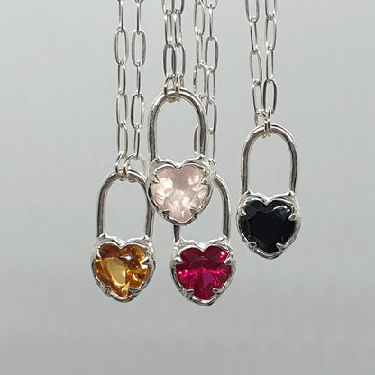 molten heart lock necklaces in different gemstones, citrine, rose quartz, ruby and black spinel