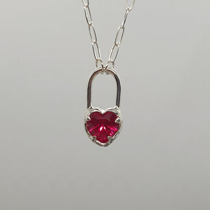 molten sterling silver heart locket necklace with lab grown ruby faceted heart