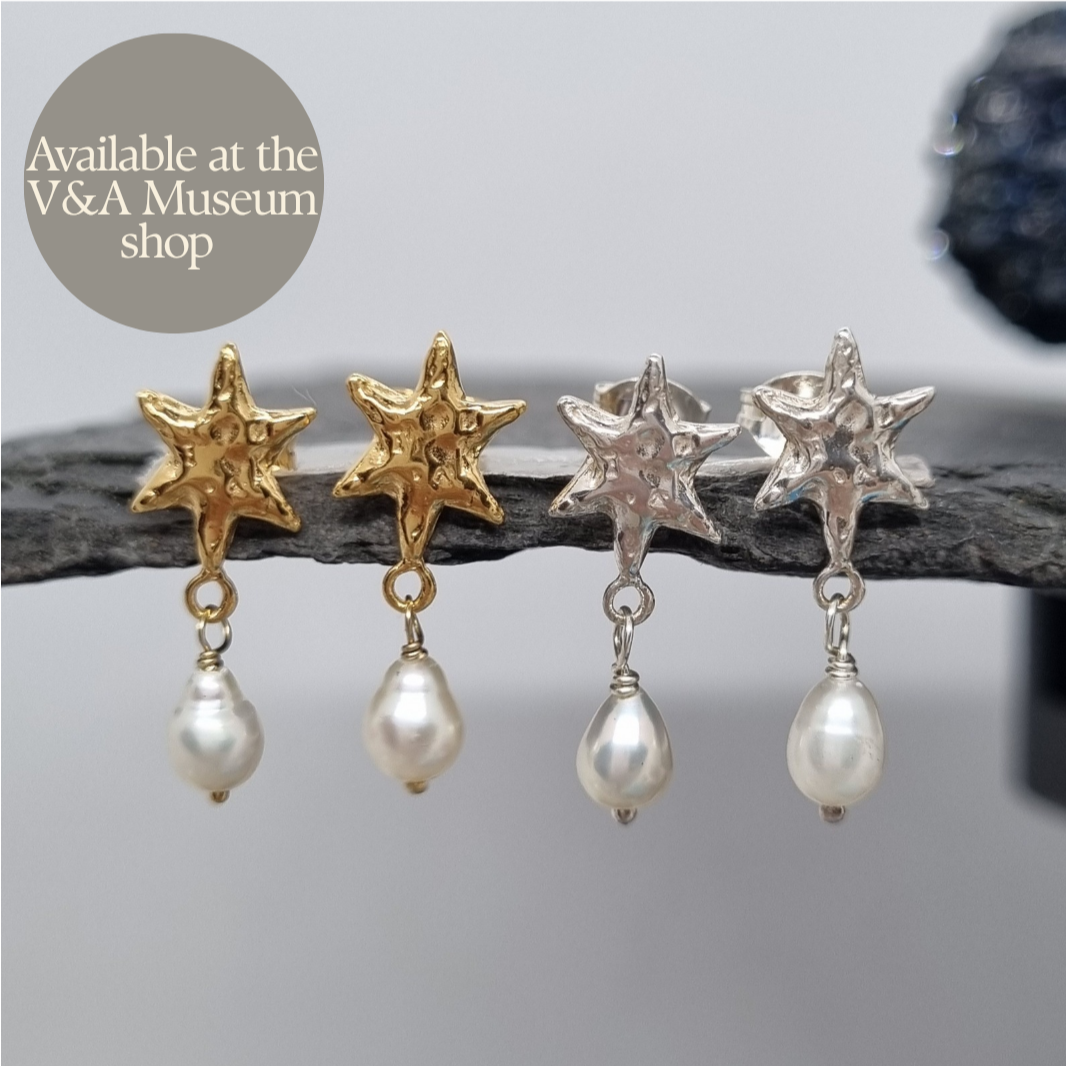 molten star stud earrings in sterling silver and gold vermeil with a little freshwater pearl drop hanging from them. Handmade by Jo Cooper. Also available at the V&A Museum shop in London, UK