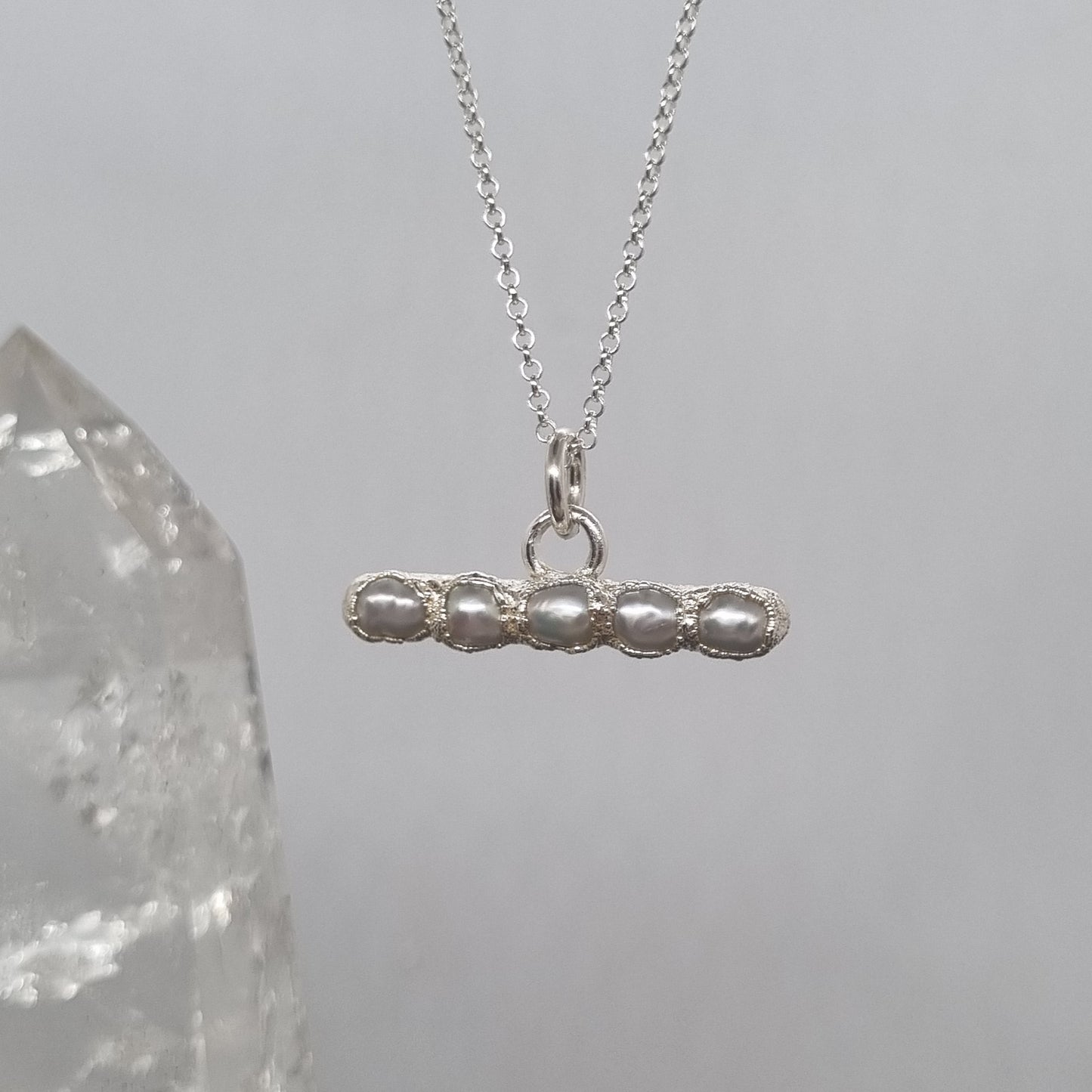 Silver t-bar necklace with a unique pendant with freshwater pearls