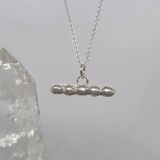 Silver t-bar necklace with a unique pendant with freshwater pearls