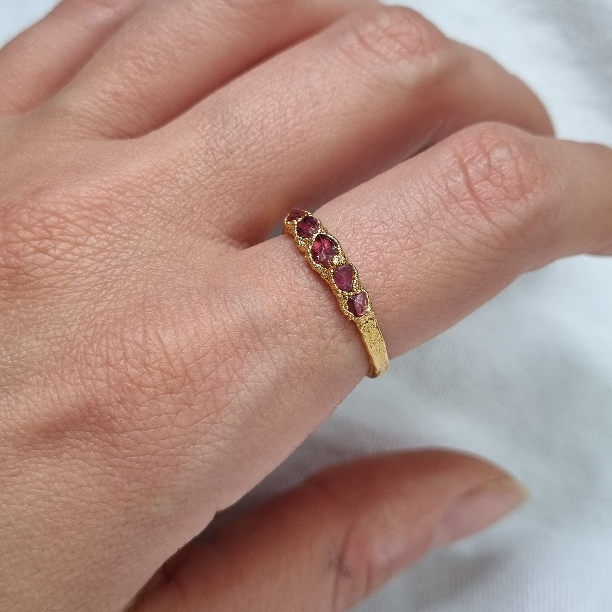 multi raw red spinel gold plated sterling silver ring on model