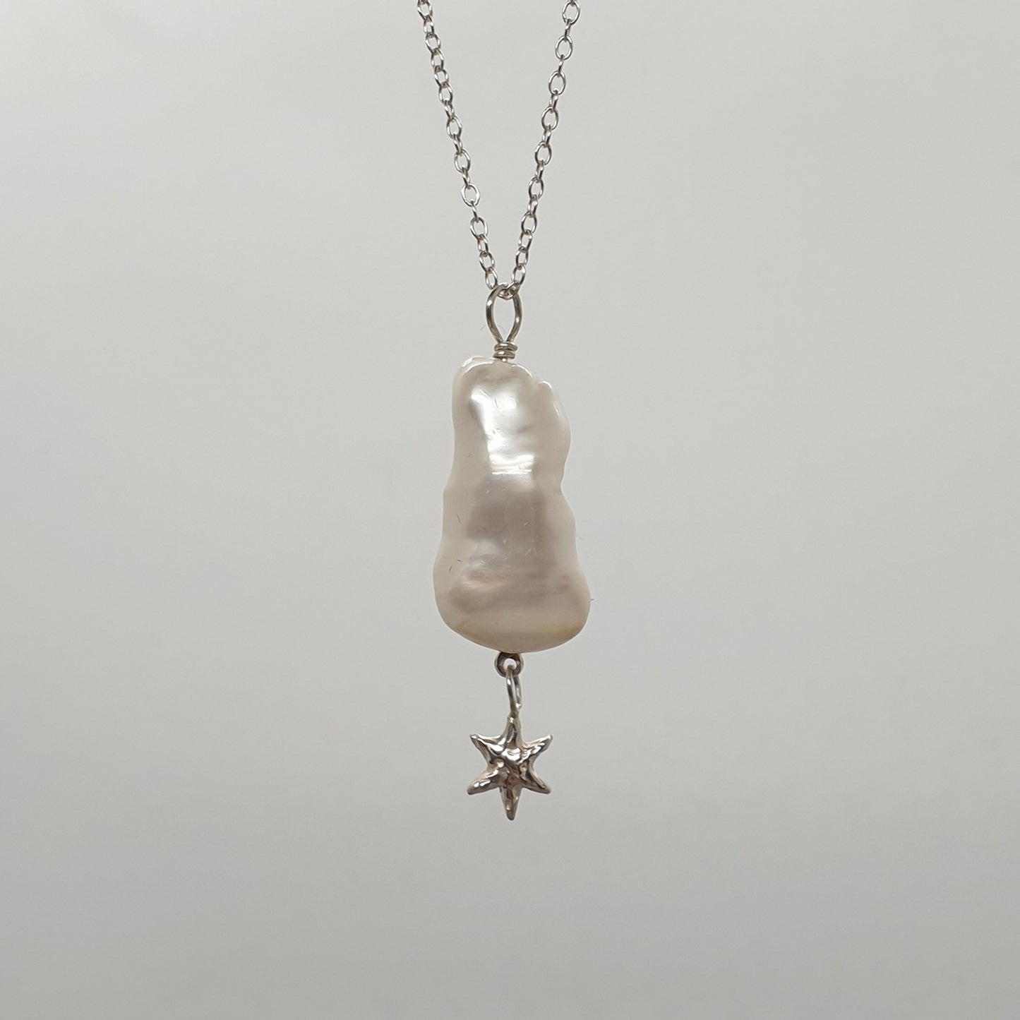 baroque pearl with hanging star necklace