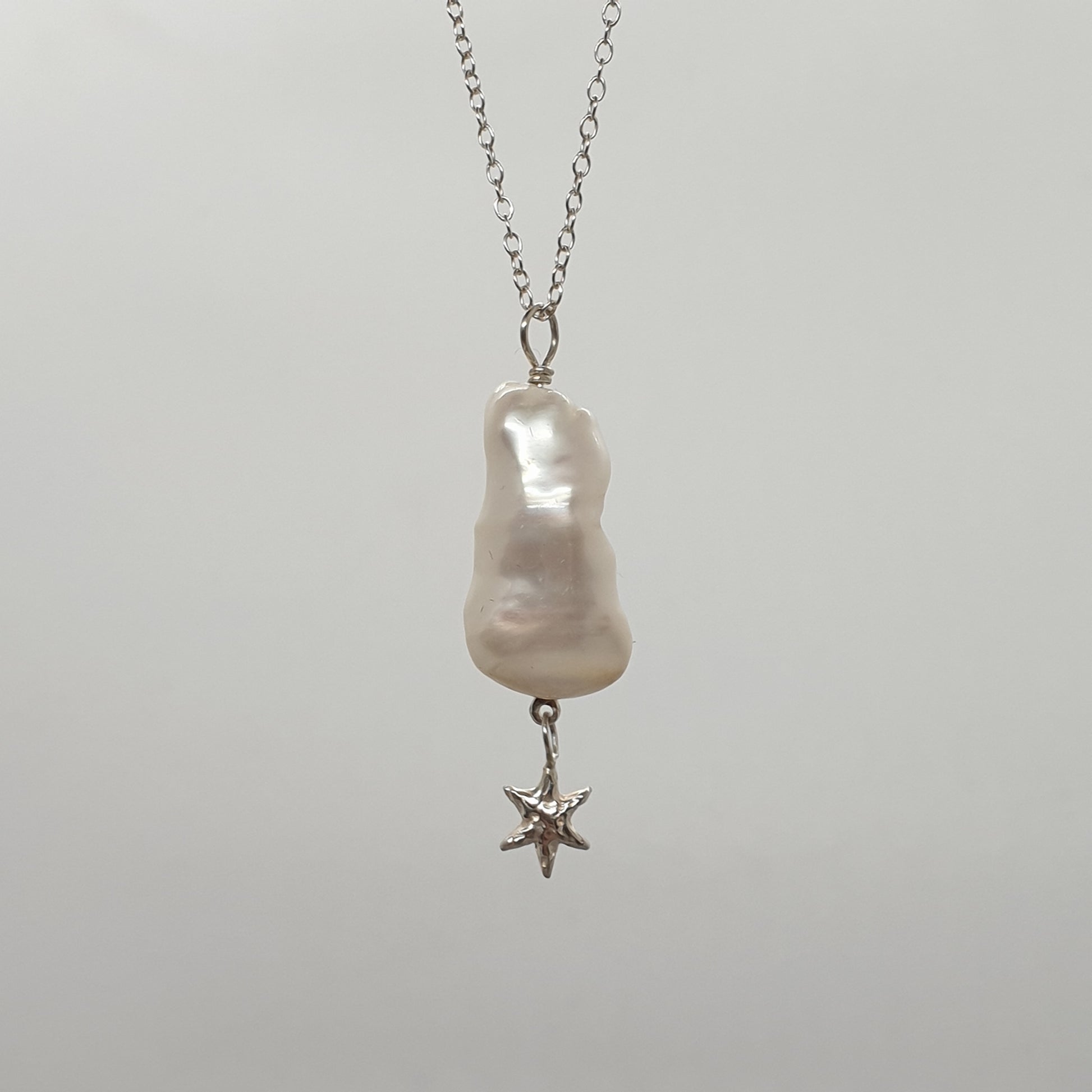 baroque pearl with hanging star necklace