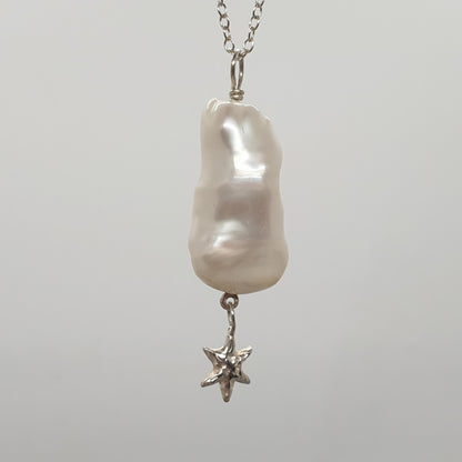 baroque freshwater pearl with hanging star necklace in sterling silver handmade in the UK