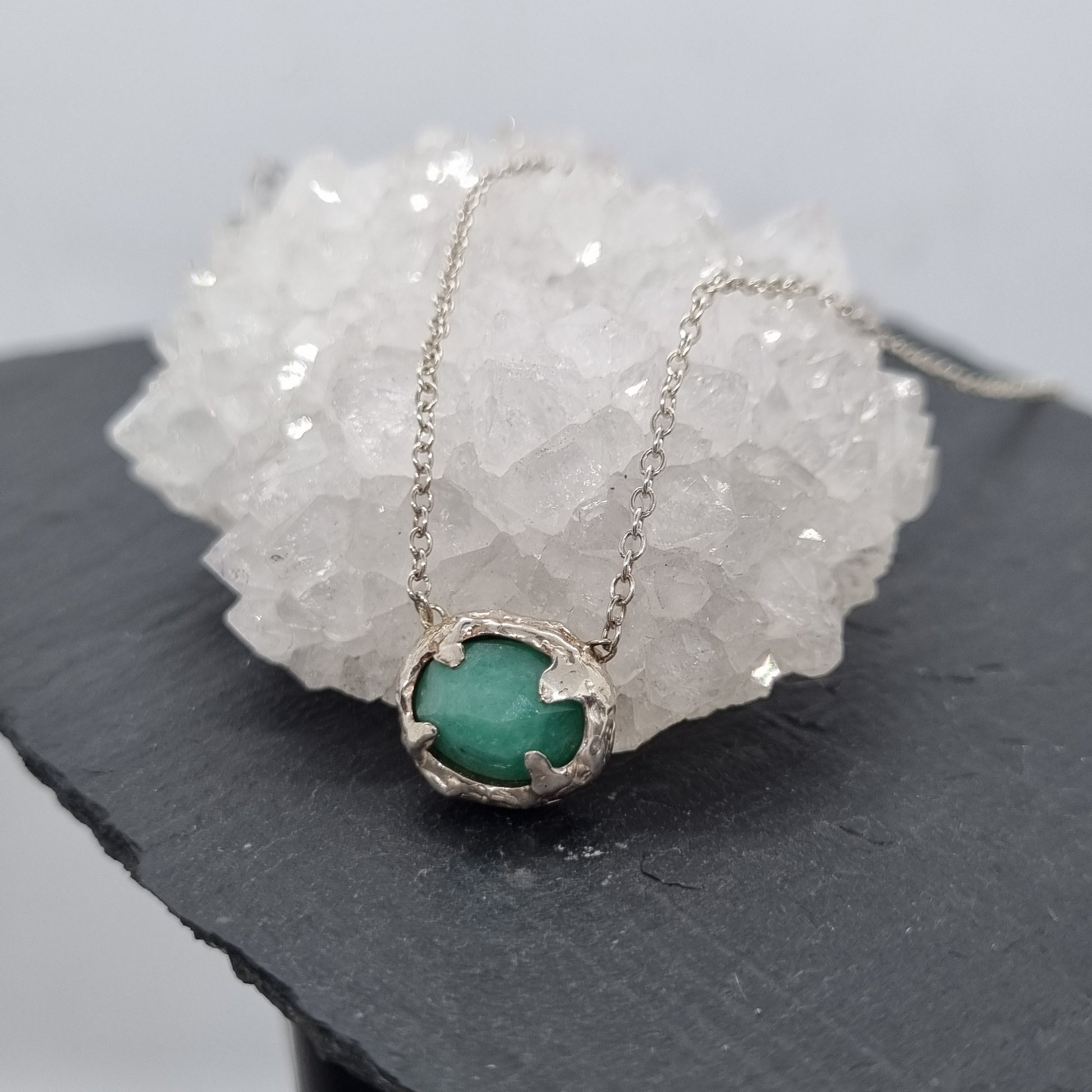 Rustic sterling silver necklace with a rose cut emerald pendant.