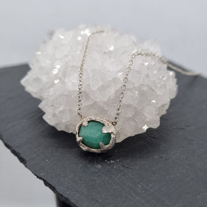 Rustic sterling silver necklace with a rose cut emerald pendant.