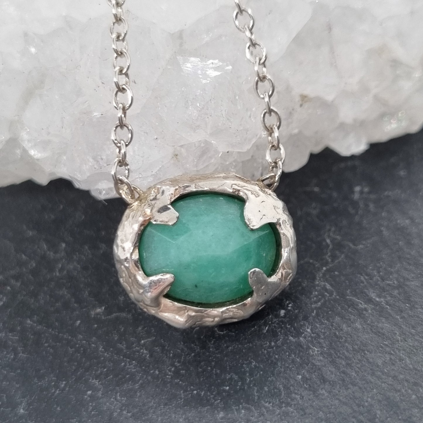 A sterling silver necklace with a rose cut emerald 