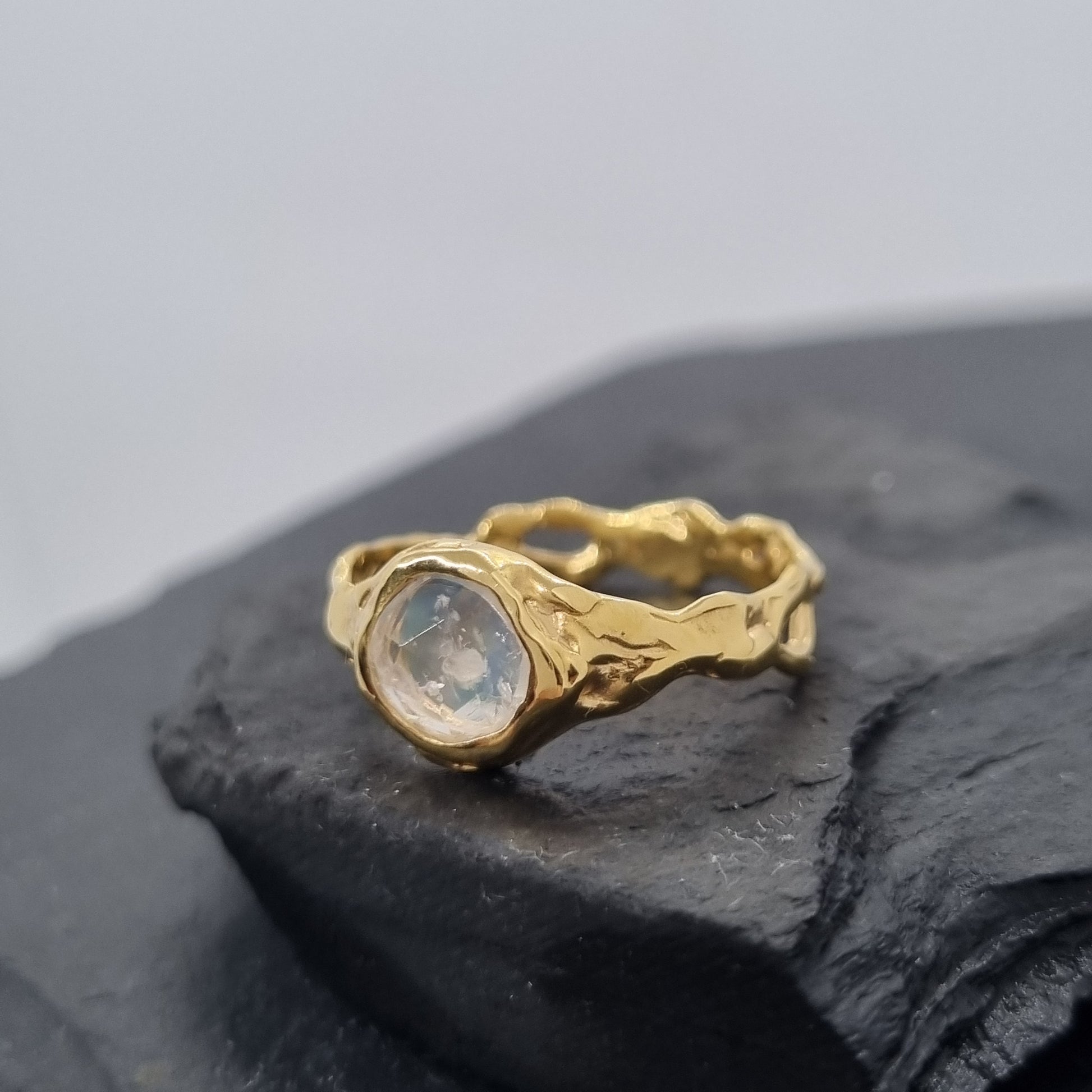 gold molten textured rustic ring with round moonstone gemstone set in the middle