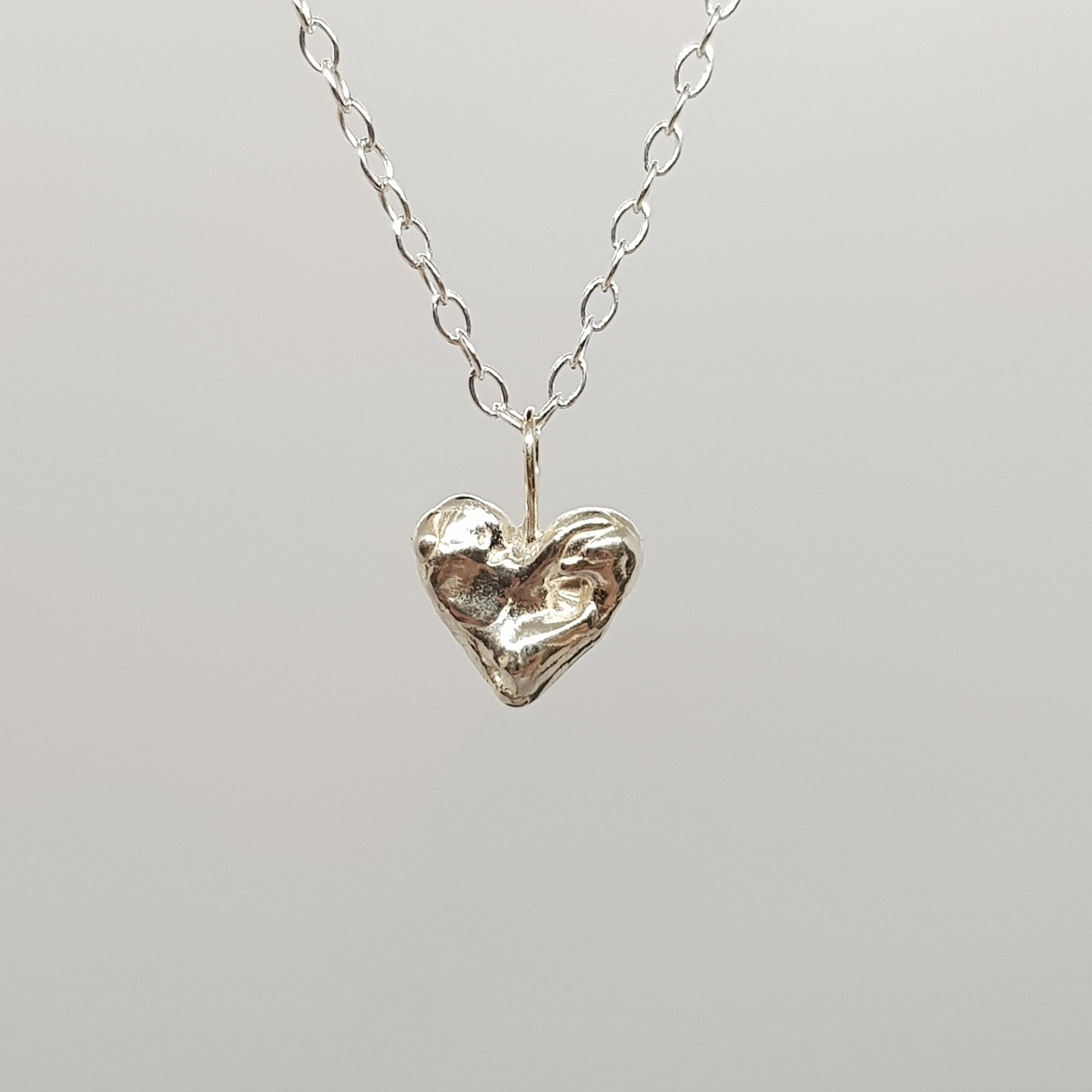 tiny sterling silver blobby heart necklace