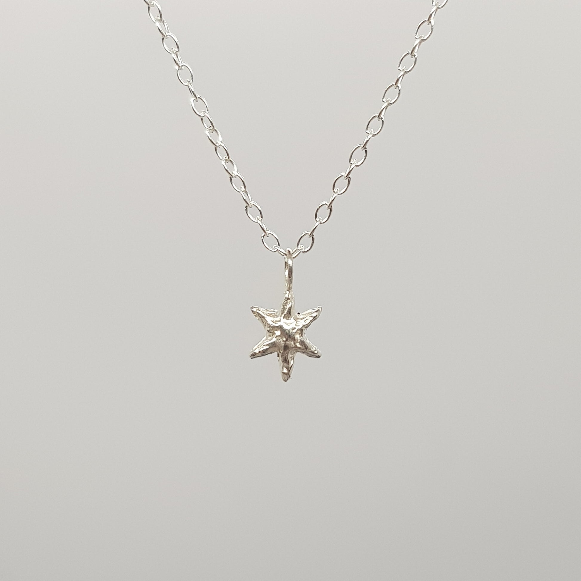 tiny molten star necklace sterling silver