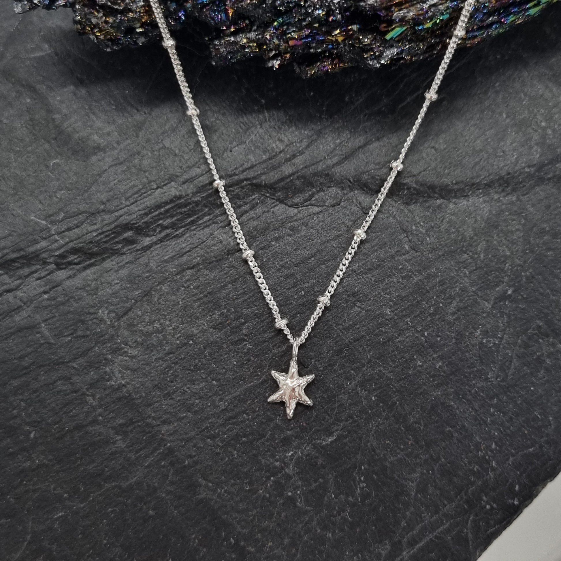 sterling silver tiny star pendant on satellite chain handmade by Jo Cooper