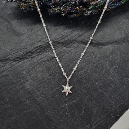 sterling silver tiny star pendant on satellite chain handmade by Jo Cooper