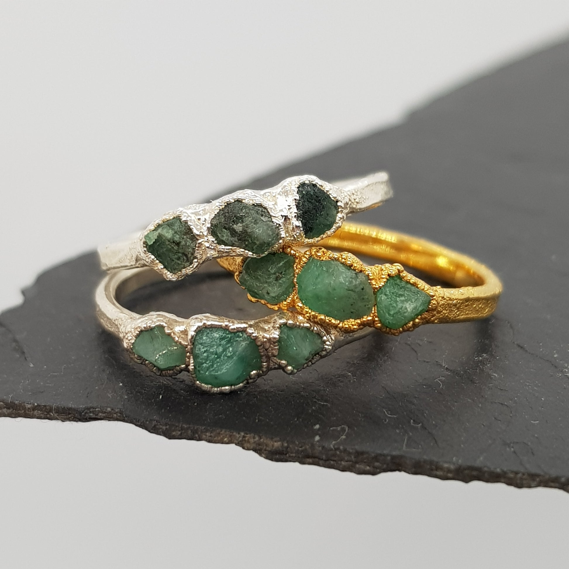 triple raw emerald gold and silver rings