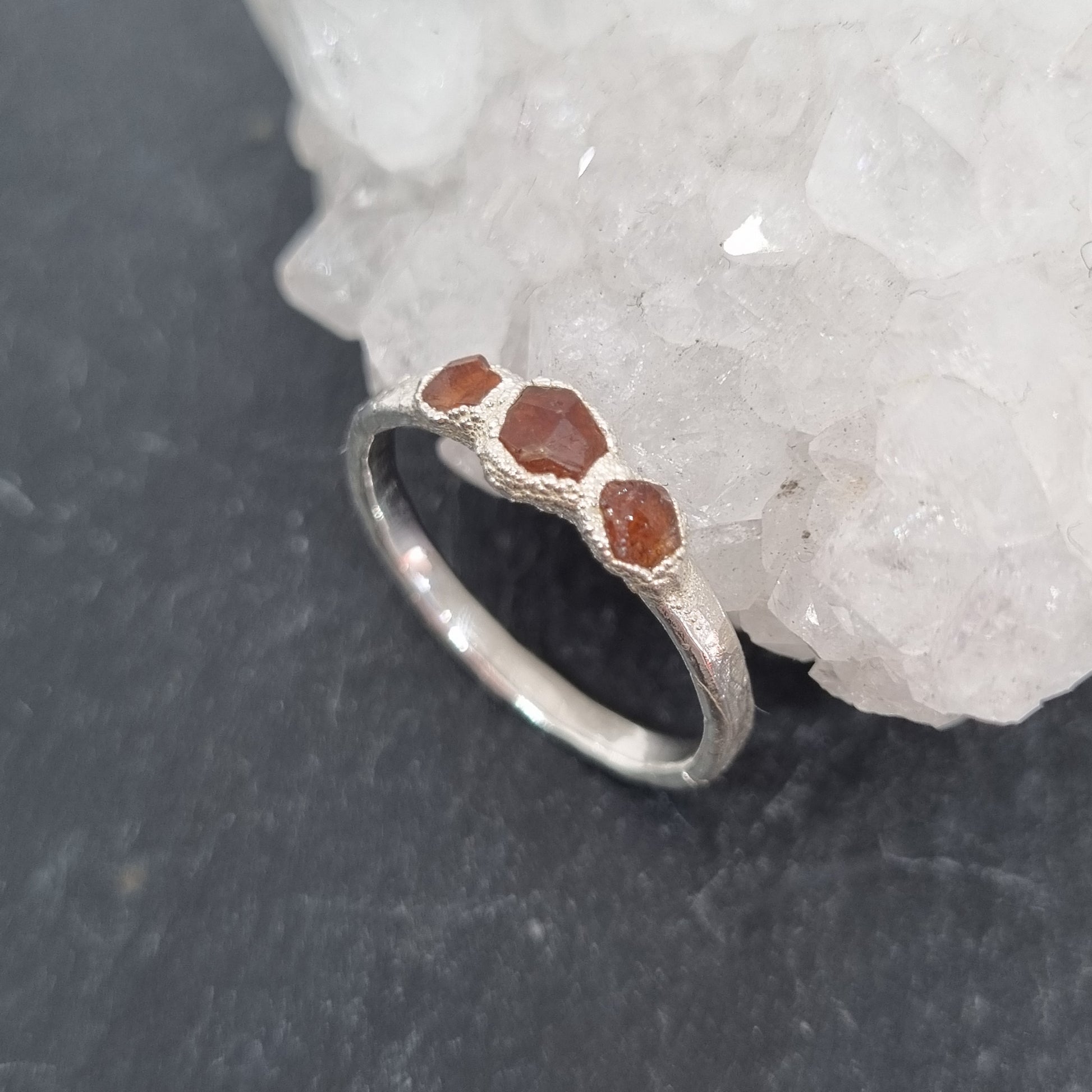 sterling silver rustic ring with three spessartite garnet crystals handmade by Jo Cooper