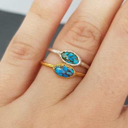 marquise Mohave turquoise raw gold and silver ring modelled on hand