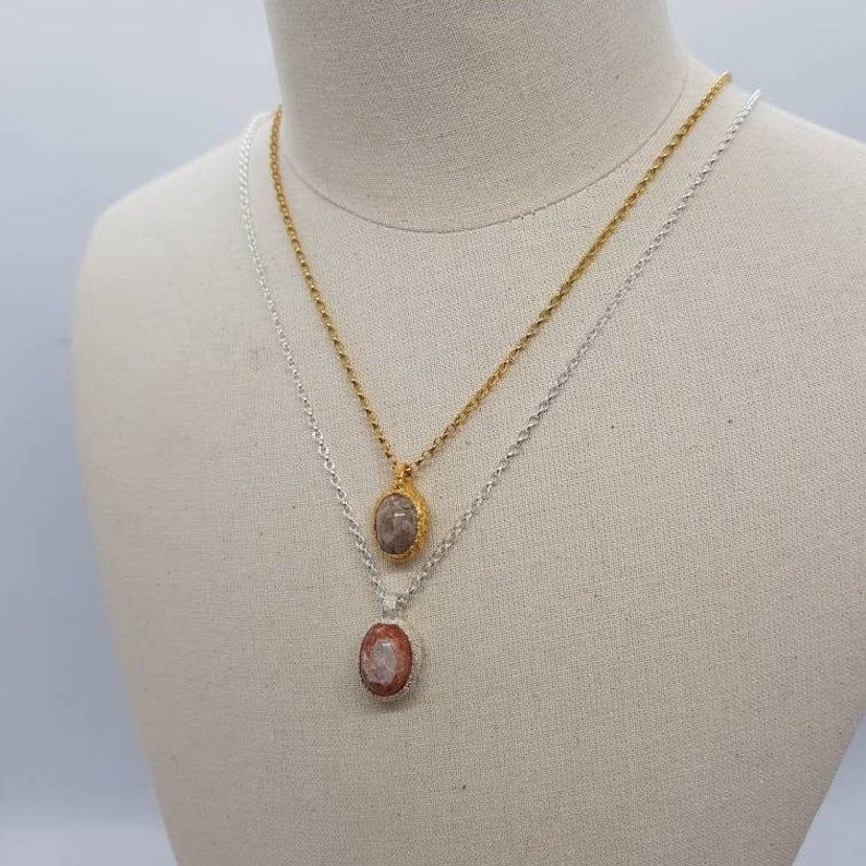 Mexican boulder opal necklaces in silver and gold displayed on a mannequin