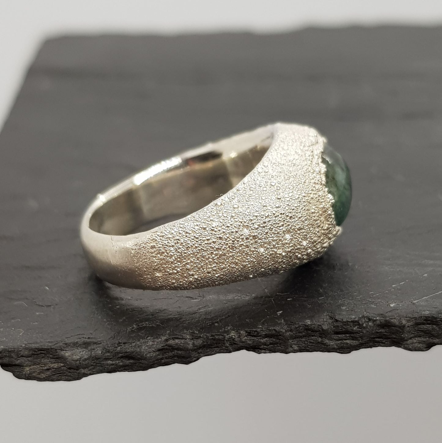 raw emerald matrix textured silver signet ring side view