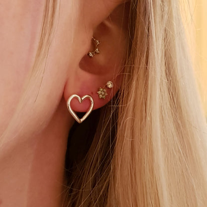 sterling silver heart stud earrings on model