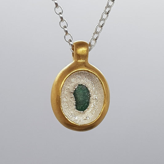 raw emerald sunken pendant necklace in gold and silver