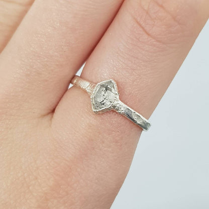 raw herkimer diamond silver  textured ring on finger